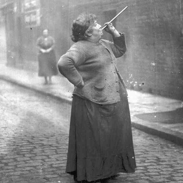 In 1931, Mary Smith earned six pence a week in east London by shooting a pea into the windows of the sleeping workers. Knocker-uppers also used long bamboo sticks, batons and canes to rouse residents of the upper floors.