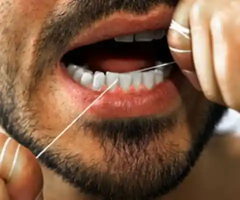 10. Not Flossing Teeth