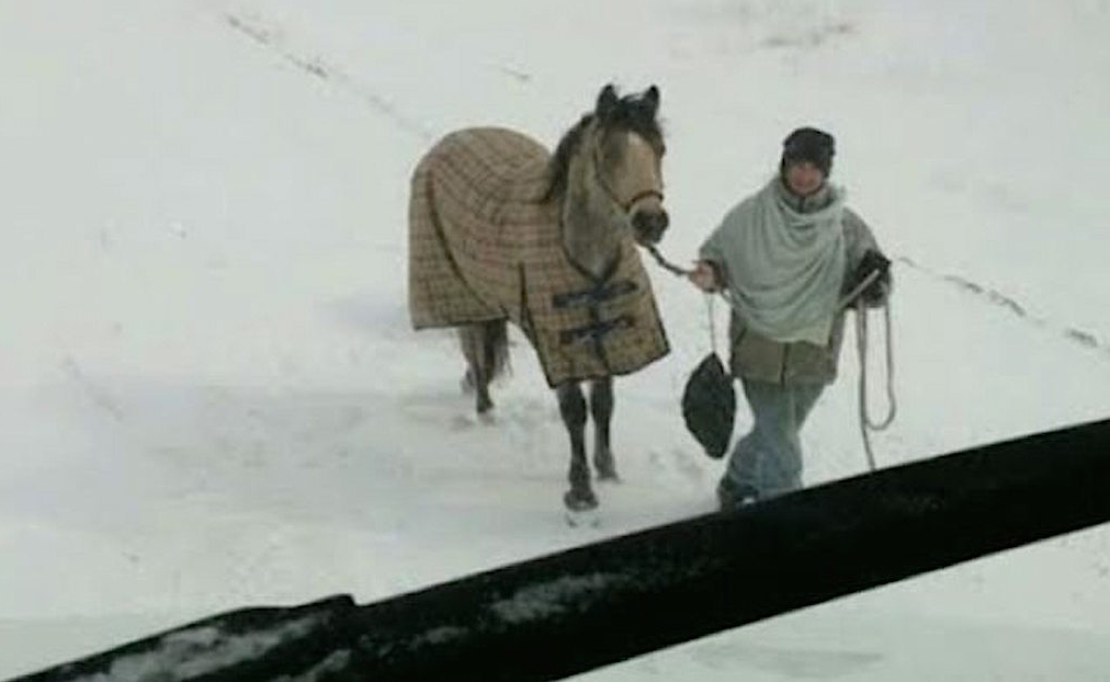 This Girl Rode Through a Snowstorm to Save a Stranded Man—And It Was All Caught On Camera