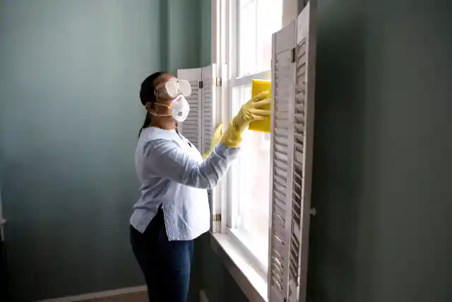 Dusting Blinds with Socks
