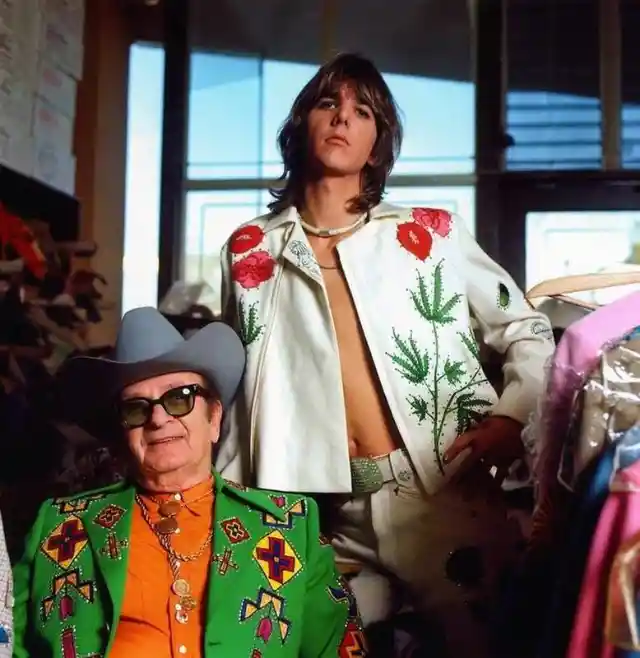 The late Gram Parsons was a singer-songwriter-guitarist and a former member of the Byrds and Flying Burrito Brothers. Here he is with tailor Nudie Cohn in 1968, wearing one of Nudie's embroidered suits.