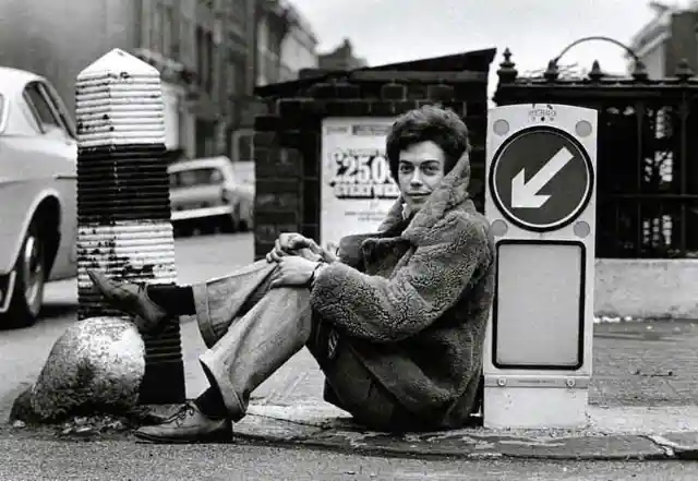 Tim Curry lounging on the streets of London, 1969.