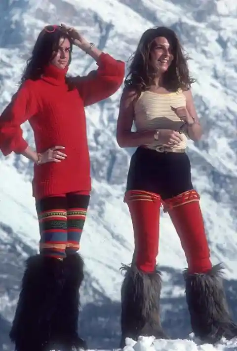 Two fashionistas modeling the latest ski fashion at the Italian ski resort of Cortina d'Ampezzo in 1976.
