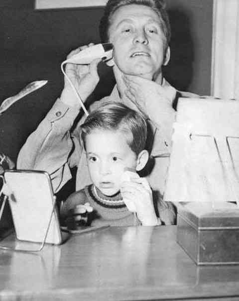 Kirk and Michael Douglas having a shave together.